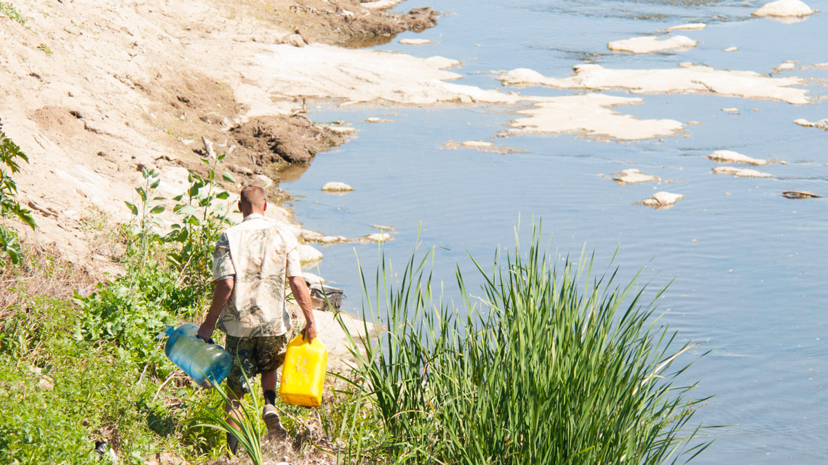 Man collects water