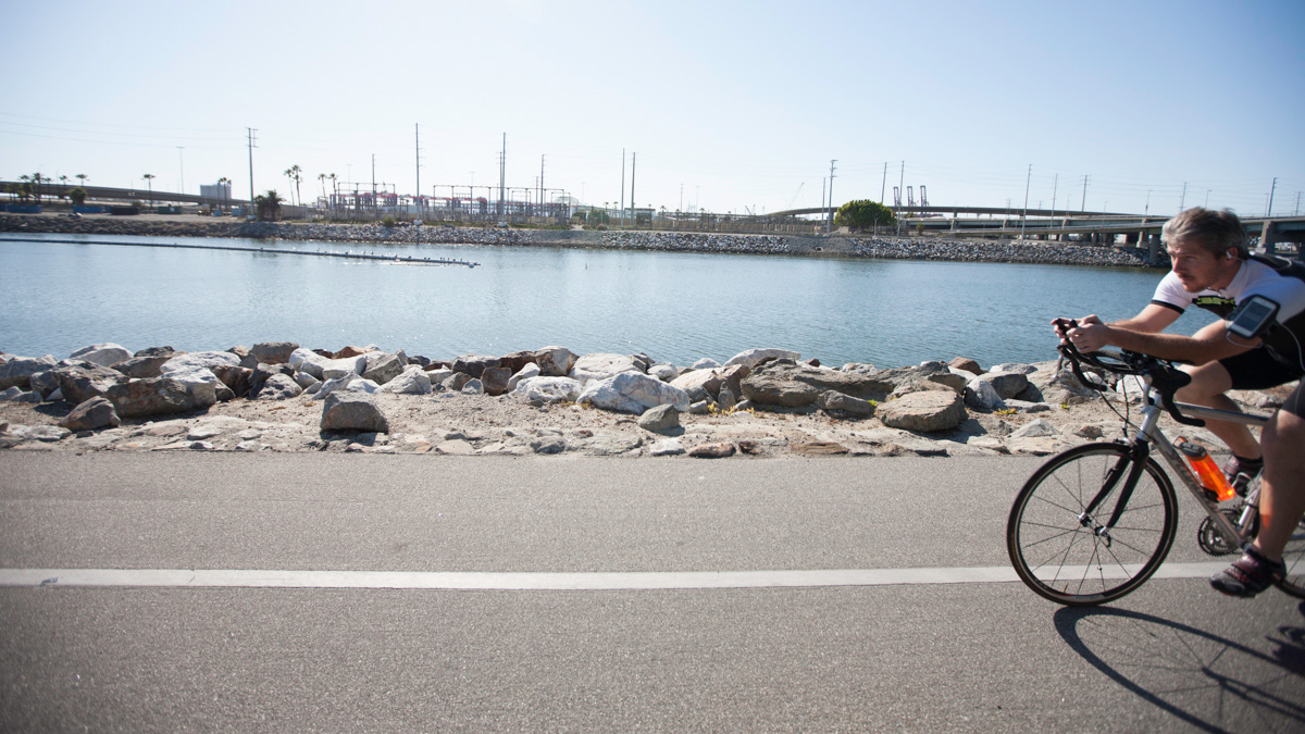 A biker passes the river